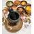 Foto de um(a) Pilão de Mesa em Pedra Sabão, da categoria de Outros utensílios. Pilão de mesa com socador em pedra sabão protegido com óleo mineral, um aliado da culinária mineira. A: 11,5 cm Diâmetro... Mostrado de uma perspectiva diferente. Vendido no marketplace Trésors.