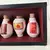 Foto de um(a) Caixa Chinesa com 07 potes Decorativos e Colecionáveis, da categoria de Outros objetos decorativos. Caixa decorativa para cozinha em madeira e 7 potes chineses em porcelana policromada, com vidro fixo. A: 16 cm / L: 50 cm /... Mostrado de uma perspectiva diferente. Vendido no marketplace Trésors.