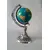 Foto de um(a) Globo Prateado, da categoria de Globos. Peça única pelo designer marcelus ribas. Globo terrestre em acrílico e latão com pátina prateada oxidada A: 25cm D: 10cm... Mostrado de uma perspectiva diferente. Vendido no marketplace Trésors.