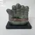 Foto de um(a) Escultura Mão em terracota, da categoria de Escultura. Escultura em terracota vitrificada com base em madeira ebanizada. Tema: mão. A: 14cm / L: 15,5cm / P: 10,5cm / peso: 625g... Mostrado de uma perspectiva diferente. Vendido no marketplace Trésors.