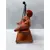 Foto de um(a) Escultura Feminina em Terracota, Peça Única, da categoria de Escultura. Escultura feminina em terracota no balanço, cabelos são de contas na cor coral, balanço em ferro com madeira e base com pés... Mostrado de uma perspectiva diferente. Vendido no marketplace Trésors.