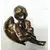 Foto de um(a) Anjo Dourado anos 80, da categoria de Modelos e estatuetas. Anjo em cerâmica revestido com pátina dourada oxidada, década de 1989. A: 16cm L: 13cm P: 18cm Peso: 440g. Mostrado de uma perspectiva diferente. Vendido no marketplace Trésors.