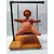 Foto de um(a) Escultura Feminina em Terracota, Peça Única, da categoria de Escultura. Escultura feminina em terracota no balanço, cabelos são de contas na cor coral, balanço em ferro com madeira e base com pés... Mostrado de uma perspectiva diferente. Vendido no marketplace Trésors.