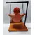 Foto de um(a) Escultura Feminina em Terracota, Peça Única, da categoria de Escultura. Escultura feminina em terracota no balanço, cabelos são de contas na cor coral, balanço em ferro com madeira e base com pés... Mostrado de uma perspectiva diferente. Vendido no marketplace Trésors.