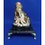 Foto de um(a) Escultura Buda Anos 80, da categoria de Escultura. Buda em gesso com pátina envelhecida, base em granito preto e pés metálico dourado. Peça única pelo designer marcelus ribas.... Mostrado de uma perspectiva diferente. Vendido no marketplace Trésors.