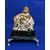 Foto de um(a) Escultura Buda Anos 80, da categoria de Escultura. Buda em gesso com pátina envelhecida, base em granito preto e pés metálico dourado. Peça única pelo designer marcelus ribas.... Mostrado de uma perspectiva diferente. Vendido no marketplace Trésors.