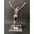 Foto de um(a) Escultura Cristo em antimônio Anos 40, da categoria de Objetos religiosos e espirituais. Cristo sem cruz em antimônio com interferência em acrílico, década de 1940. A: 35 cm Base: 15 x 13 cm Peso: 1,354 kg. Mostrado de uma perspectiva diferente. Vendido no marketplace Trésors.