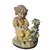 Foto de um(a) Bela escultura decorativa em resina, da categoria de Modelos e estatuetas. Esta delicada escultura decorativa retrata uma menina ajoelhada vestindo um gracioso vestido amarelo, segurando... Vendido no marketplace Trésors.