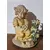 Foto de um(a) Bela escultura decorativa em resina, da categoria de Modelos e estatuetas. Esta delicada escultura decorativa retrata uma menina ajoelhada vestindo um gracioso vestido amarelo, segurando... Mostrado de uma perspectiva diferente. Vendido no marketplace Trésors.