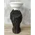 Foto de um(a) Castiçal Porcelana, da categoria de Castiçais. Castiçal em porcelana branca, parte texturizada na cor preta e branco liso/craquelado, com pendente em couro. A: 28 cm... Mostrado de uma perspectiva diferente. Vendido no marketplace Trésors.