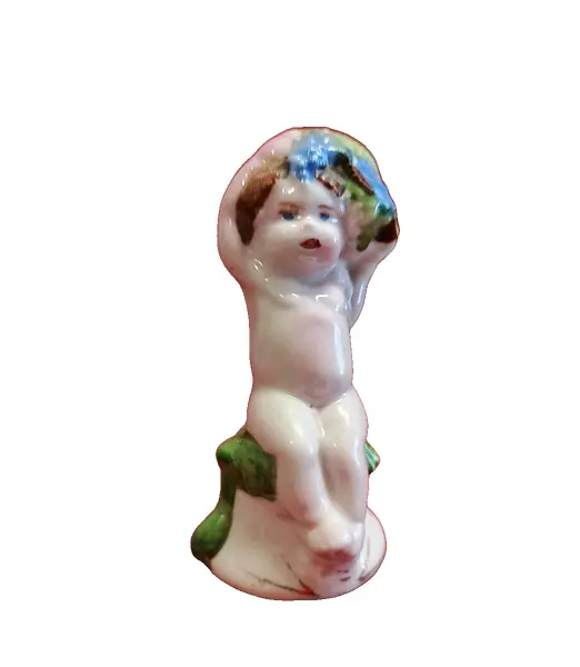 Foto de um(a) Sineta Baco Baby em Porcelana Italiana, Década de 1970, da categoria de Outros colecionáveis. Sineta de mesa em porcelana italiana policromada representando baco baby, com badalo em porcelana, década de 1970. A: 8,5 cm... Vendido no marketplace Trésors.