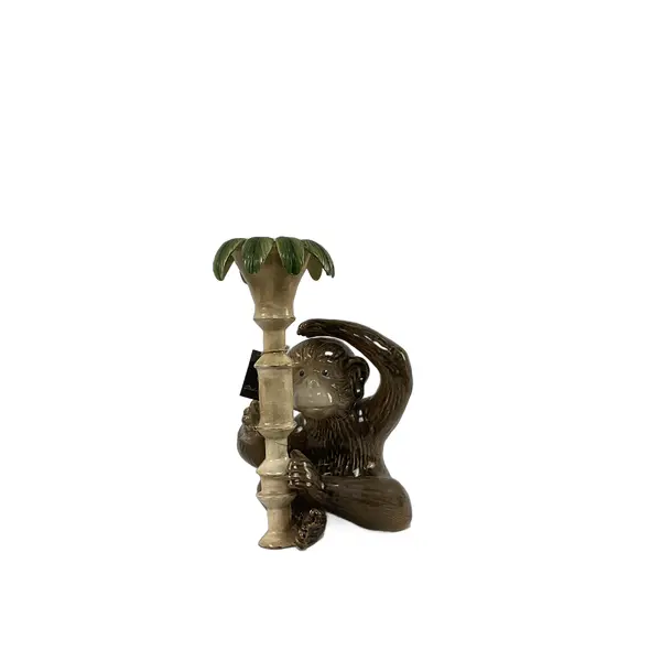 Foto de um(a) Castiçal em Cerâmica em Forma de Macaco, da categoria de Castiçais. Castiçal fabricado em cerâmica, representando um macaco junto a um pilar com folhas. Vendido no marketplace Trésors.
