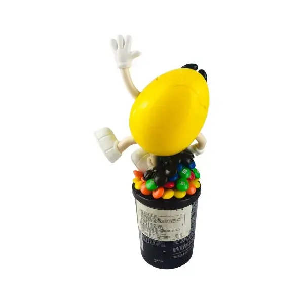 Foto de um(a) Pote M&m, da categoria de Garrafas, potes e jarros. Pote de M&M (24cm de altura) e lata de M&M's. Ambos apresentam sinais de uso, mas em bom estado de conservação. Mostrado de uma perspectiva diferente. Vendido no marketplace Trésors.