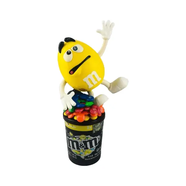 Foto de um(a) Pote M&m, da categoria de Garrafas, potes e jarros. Pote de M&M (24cm de altura) e lata de M&M's. Ambos apresentam sinais de uso, mas em bom estado de conservação. Vendido no marketplace Trésors.