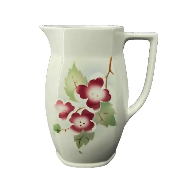 Foto de um(a) Antiga Jarra Art Deco Porcelana Faiança Majólica Alemã, da categoria de Jarros. Antiga jarra em faiança/majólica alemã. Decoração floral típica do período Art Deco. Peça numerada.Medidas 16x13cm. Vendido no marketplace Trésors.