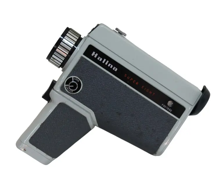 Foto de um(a) Antiga filmadora HALINA SUPER EIGHT, da categoria de Câmeras fotográficas. Antiga filmadora da marca HALINA SUPER EIGHT, fabricada em Hong Kong pela W.Hanking Entrerprises ltd entre 1968/1972.... Vendido no marketplace Trésors.